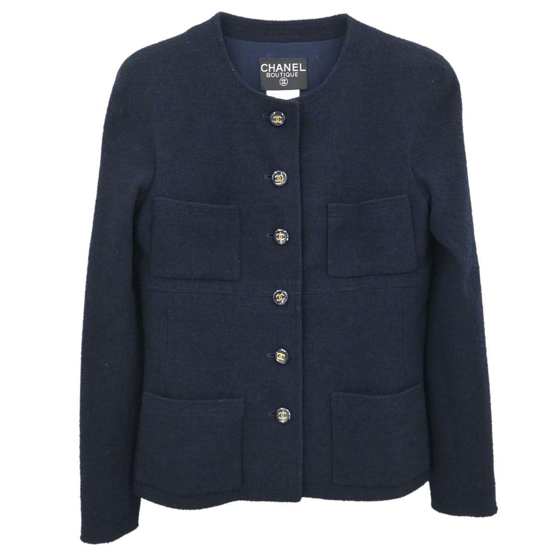 CHANEL 95P Navy Collarless Wool Jacket Size 38: CHANEL 95P Navy Collarless Wool Jacket Size 38 Vintage CHANEL collarless single-breasted jacket in navy, designed with a regular fit and long sleeves. It is a mid-length women's jacket with button clo
