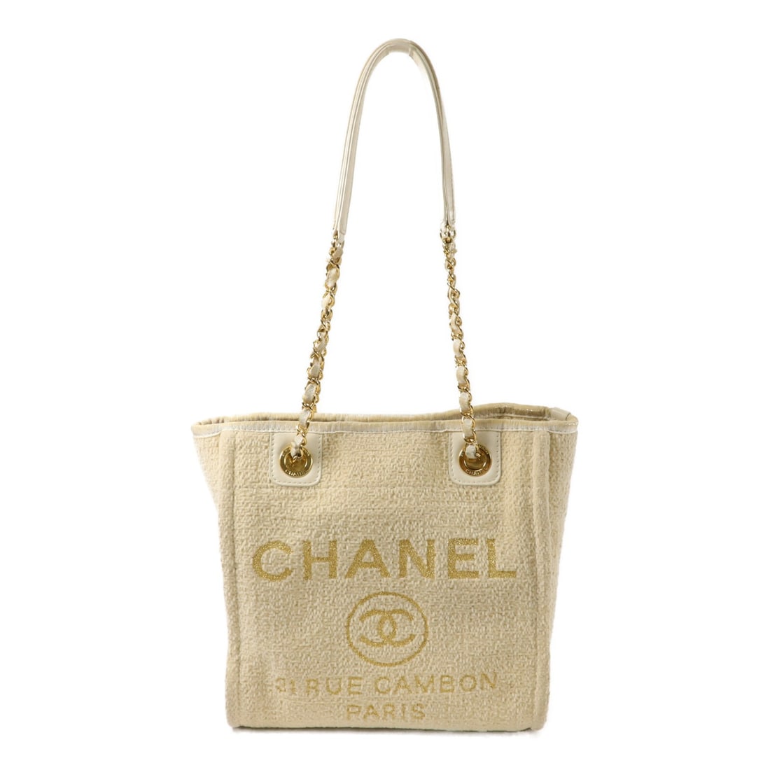CHANEL A66939 Deauville Mini Chain Tote Beige Lurex Boucle: CHANEL A66939 Deauville Mini Chain Tote Beige Lurex Boucle CHANEL CC GHW Deauville Mini Chain Tote Bag in beige Lurex Boucle. It features a magnetic pocket, one inside open pocket, and one inside zip 