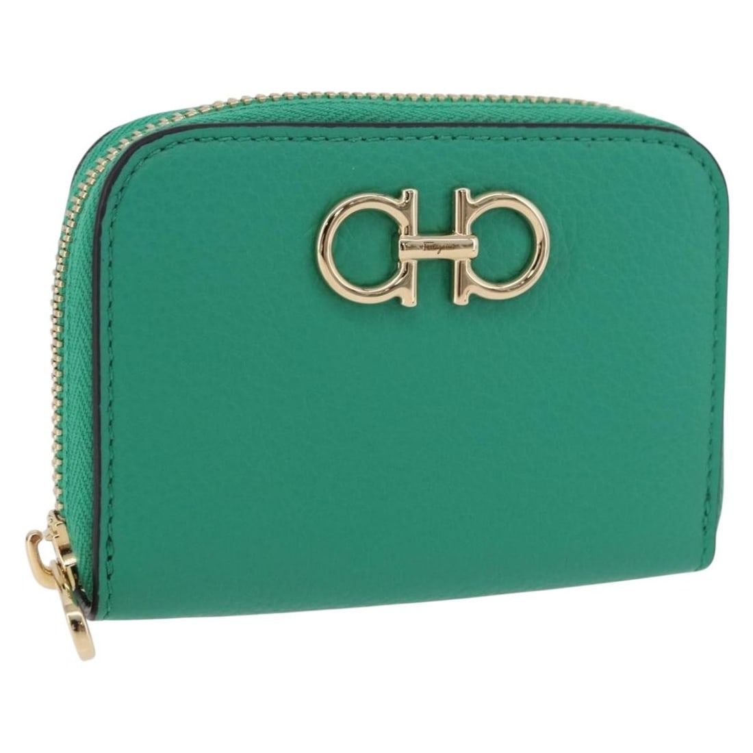 Leather coin purse Salvatore Ferragamo Gancini green gold tone: Leather coin purse Salvatore Ferragamo Gancini green gold tone This Salvatore Ferragamo coin purse is crafted from leather in a green and gold tone finish. It comes with an item box and is made in Ita