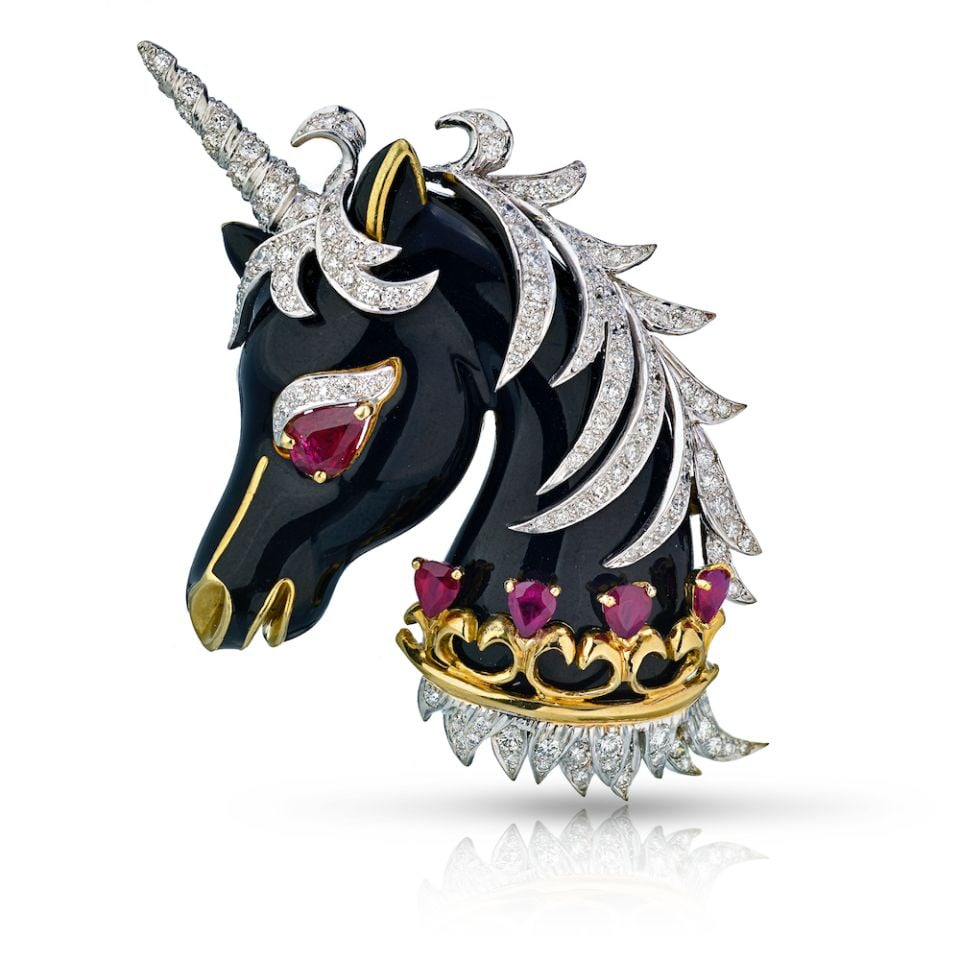 David Webb 1965 Unicorn Brooch Platinum 18K Gold Ruby Diamonds Enamel: David Webb 1965 Unicorn Brooch Platinum 18K Gold Ruby Diamonds Enamel This exquisite David Webb brooch showcases a stunning unicorn design crafted from premium platinum and 18K yellow gold. The piece 