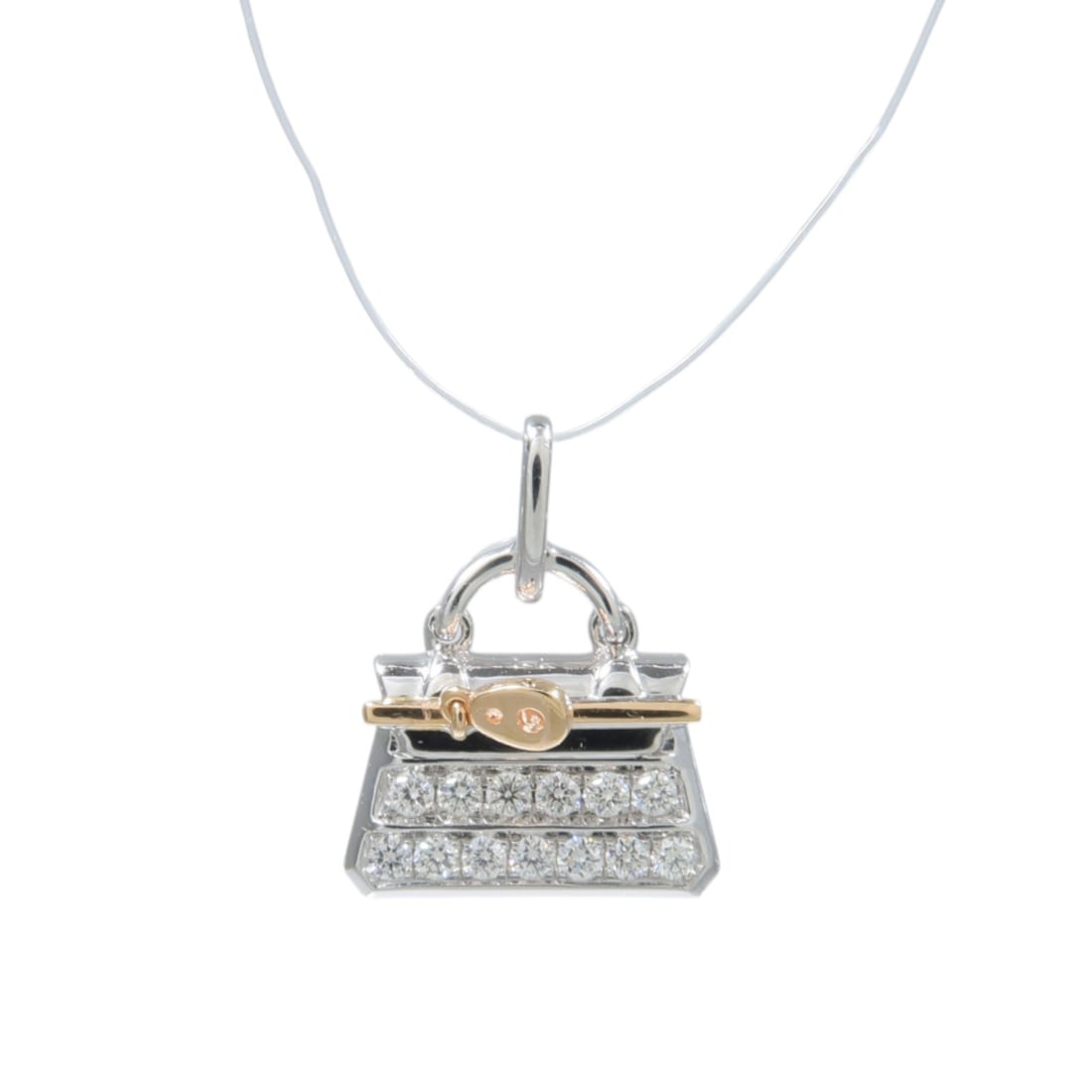 18K Rose and White Gold Diamond Pendant 0.25ct: 18K Rose and White Gold Diamond Pendant 0.25ct Diamond pendant in 18K rose gold and white gold with clear diamonds. The pendant measures 18 mm x 14 mm and has a weight of 3 g. Condition is AB: Very Go