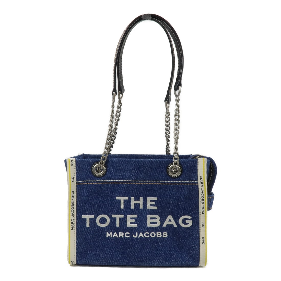 Denim Chain Shoulder Bag by Marc Jacobs in Blue: Denim Chain Shoulder Bag by Marc Jacobs in Blue Marc Jacobs SHW Chain Shoulder Bag in blue denim. The bag features a chain shoulder strap, a fastener closure, and an interior zip pocket and card pocke