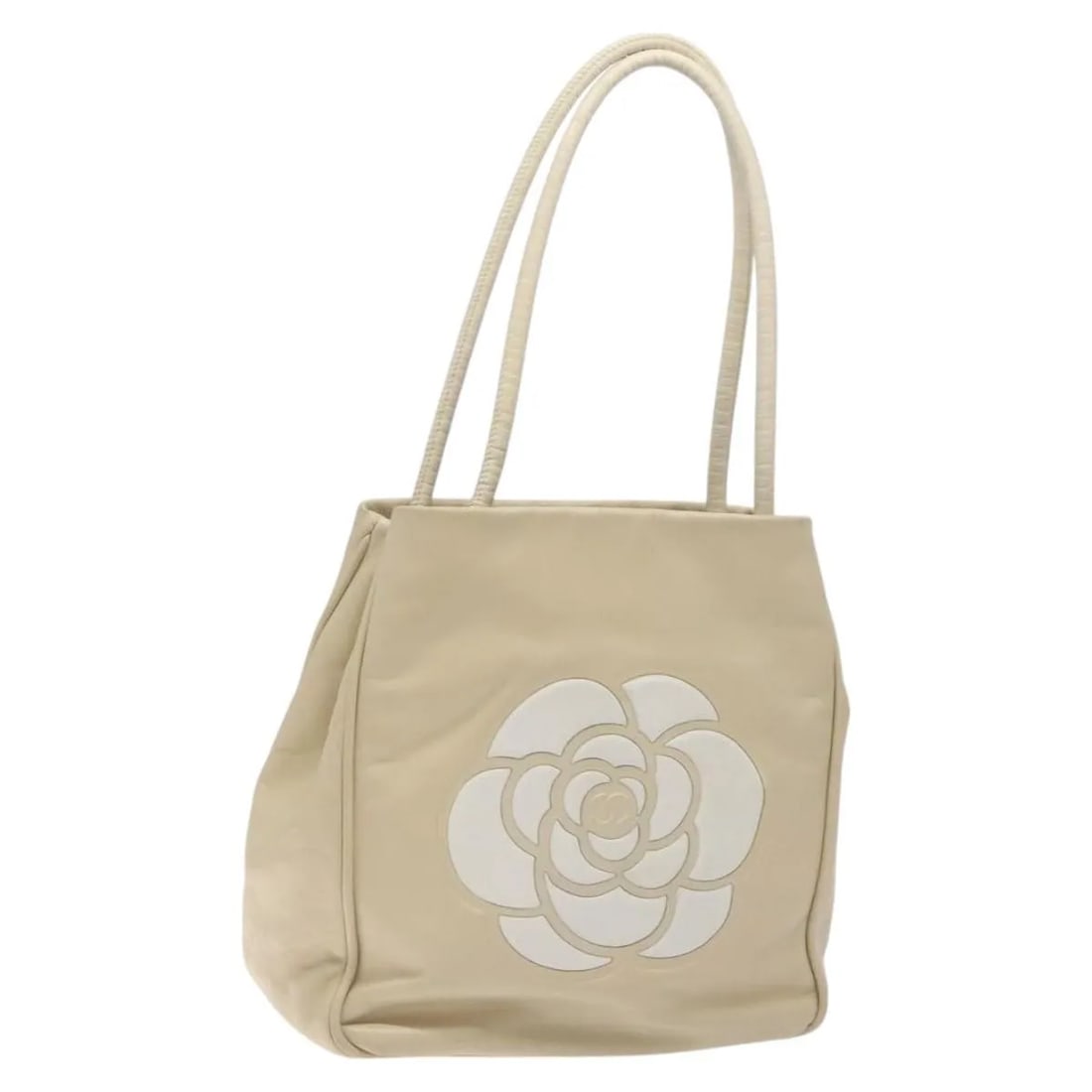 Chanel Camellia Tote Beige Leather Handbag: Chanel Camellia Tote Beige Leather Handbag Chanel Camellia Tote in beige leather. This women's bag is presented in good condition with visible wear from use. Noted condition details include shape loss