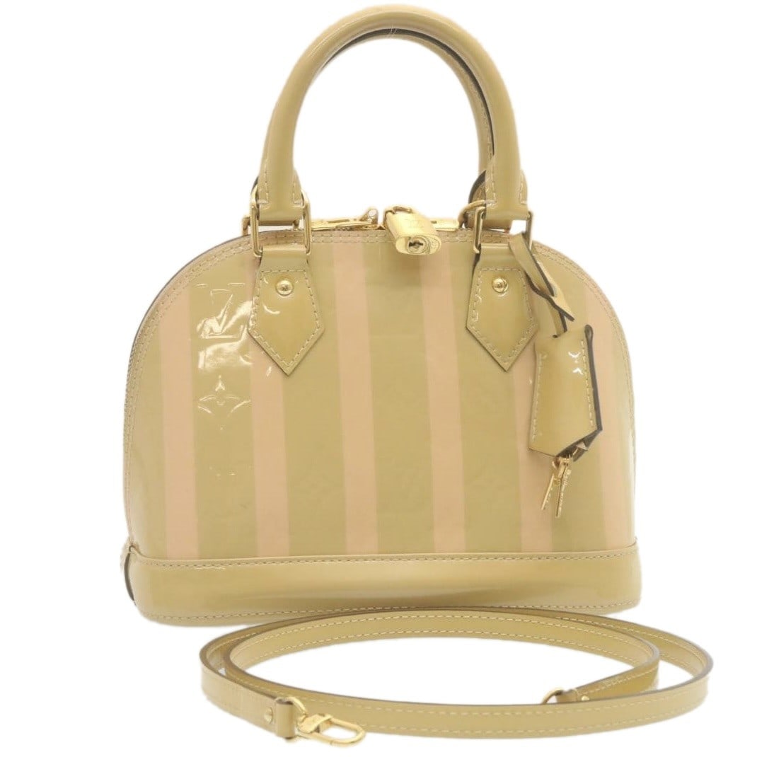 Louis Vuitton Alma BB Rayures Vernis 2way Patent Leather Bag M90970: Louis Vuitton Alma BB Rayures Vernis 2way Patent Leather Bag M90970 Louis Vuitton Vernis Rayures Alma BB handbag in beige and pink patent leather. This 2-way women's bag is made in France and includes
