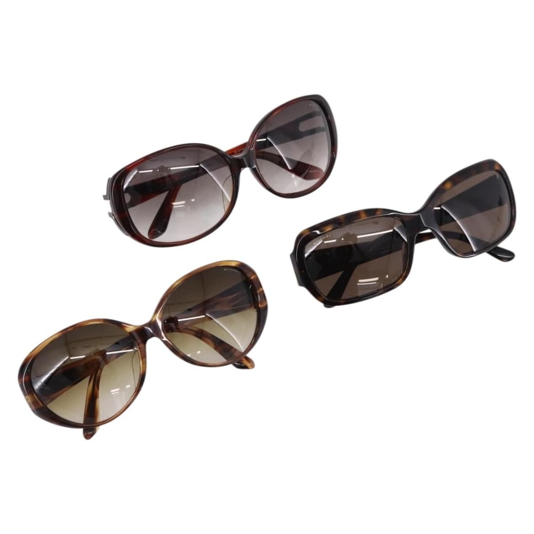 3 Piece BVLGARI Plastic Sunglasses Bundle with Case Brown Gold Silver: 3 Piece BVLGARI Plastic Sunglasses Bundle with Case Brown Gold Silver BVLGARI sunglasses in brown, gold, and silver plastic, offered as a special bundle set of 3. The listing includes a sunglass case.