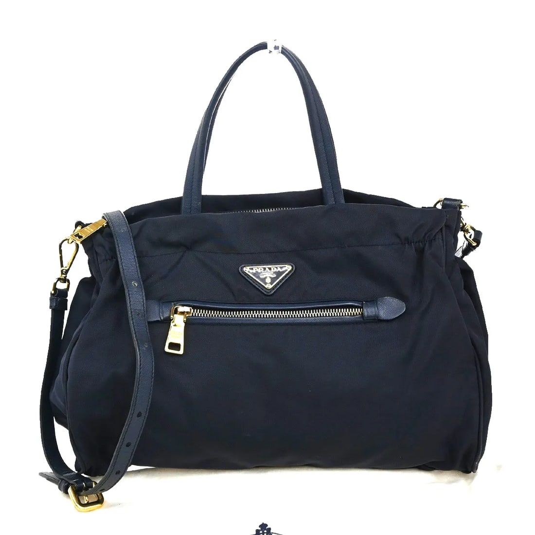 Prada Tessuto Nylon Tote Bag with Saffiano Leather Trim Navy: Prada Tessuto Nylon Tote Bag with Saffiano Leather Trim Navy This Prada Zip Convertible Shopping Tote is crafted from navy nylon with Saffiano leather accents. Designed for women, it features a spacio