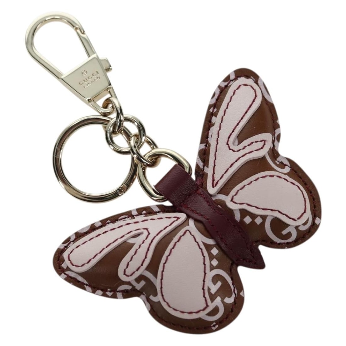 Gucci Embossed Leather Butterfly Bag Charm Brown Gold: Gucci Embossed Leather Butterfly Bag Charm Brown Gold This GUCCI GG embossed leather butterfly bag charm features a stylish brown and gold color combination. Crafted from high-quality leather, the cha