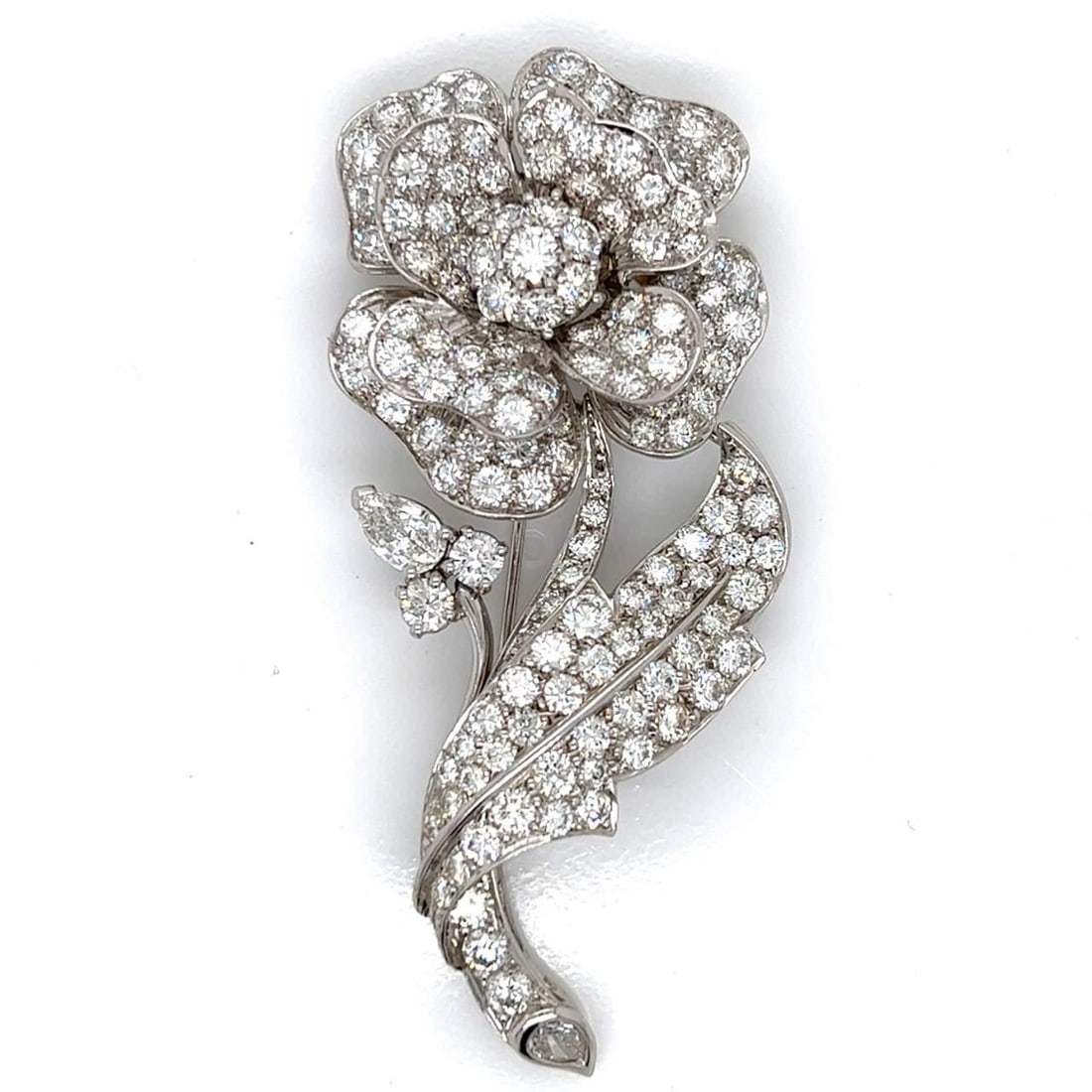 Platinum Rose Brooch 14.50 Ct Diamonds D-F VVS-VS 2.75 Inches: Platinum Rose Brooch 14.50 Ct Diamonds D-F VVS-VS 2.75 Inches This stunning brooch features a beautifully crafted rose design, made from platinum and adorned with a total of 145 diamonds, weighing app
