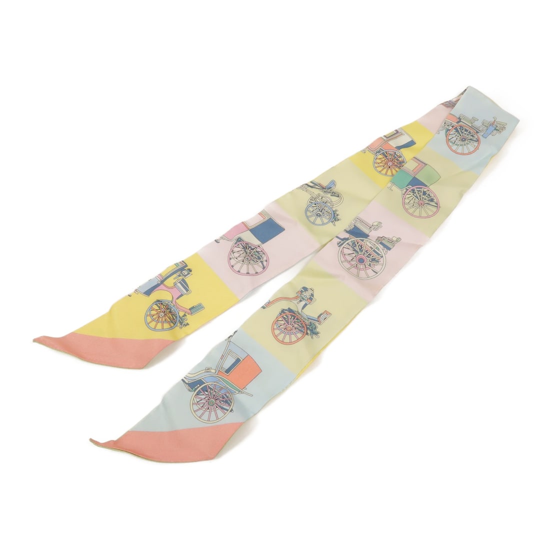 Hermes Twilly Silk Scarf in Yellow and Green: Hermes Twilly Silk Scarf in Yellow and Green Hermes Twilly scarf in silk with a yellow, green, yellow/blue/green color combination. The item measures 86 cm x 5 cm (33.9 in x 2.0 in) and is in B condit