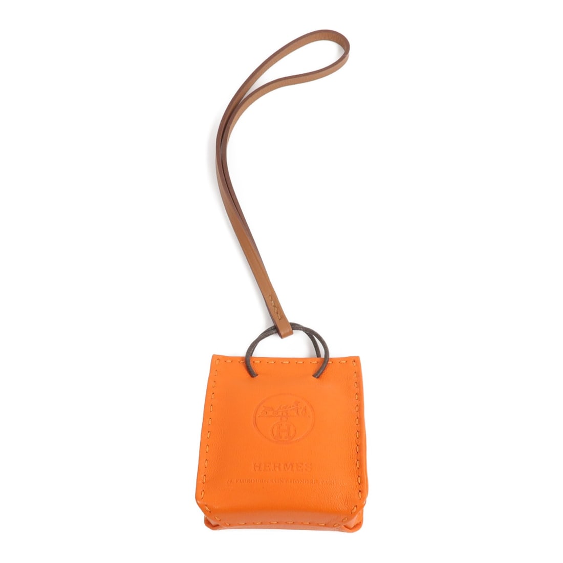 Hermes Milo Lambskin Sac Orange Bag Charm with Box: Hermes Milo Lambskin Sac Orange Bag Charm with Box Orange bag charm made from Agneau Milo lambskin (sheep leather) in a compact charm size. The item is identified as HERMES Sac Orange Bag Charm Milo L