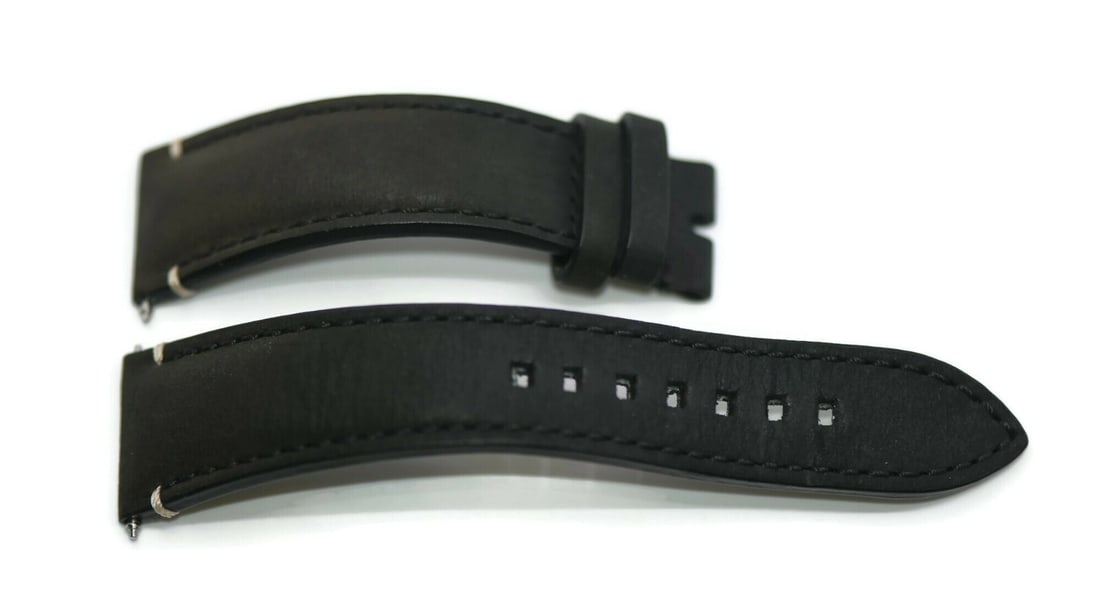 Ulysse Nardin Authentic Black Leather 20mm Two-Piece Watch Strap: Ulysse Nardin Authentic Black Leather 20mm Two-Piece Watch Strap This Ulysse Nardin wristwatch band is a stylish and versatile accessory crafted from high-quality black leather. It features a two-piec