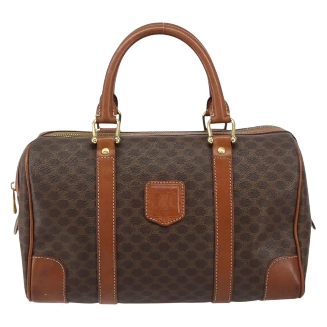 Brown Canvas Boston Handbag by Celine Macadam Vintage Collection: Brown Canvas Boston Handbag by Celine Macadam Vintage Collection This is a Celine Vintage Macadam Boston bag crafted from brown canvas. Designed for women, the bag features leather accents and metal f