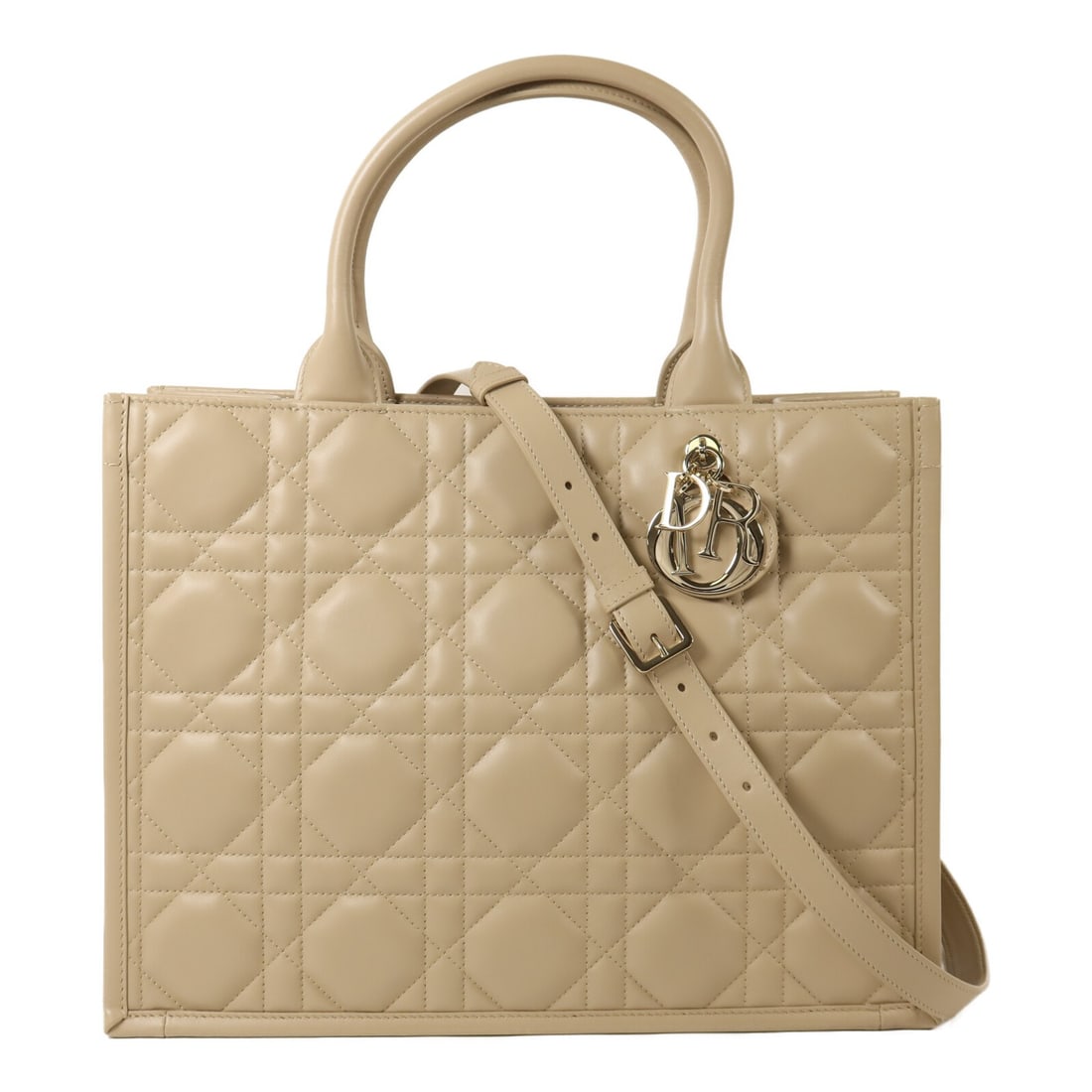 Dior Book Tote Medium 2 Way Shoulder Bag Beige Calfskin M13240WHP51UU: Dior Book Tote Medium 2 Way Shoulder Bag Beige Calfskin M13240WHP51UU This Christian Dior Book Tote medium 2-way shoulder bag is crafted in beige calfskin (cowhide) and designed for women. It features