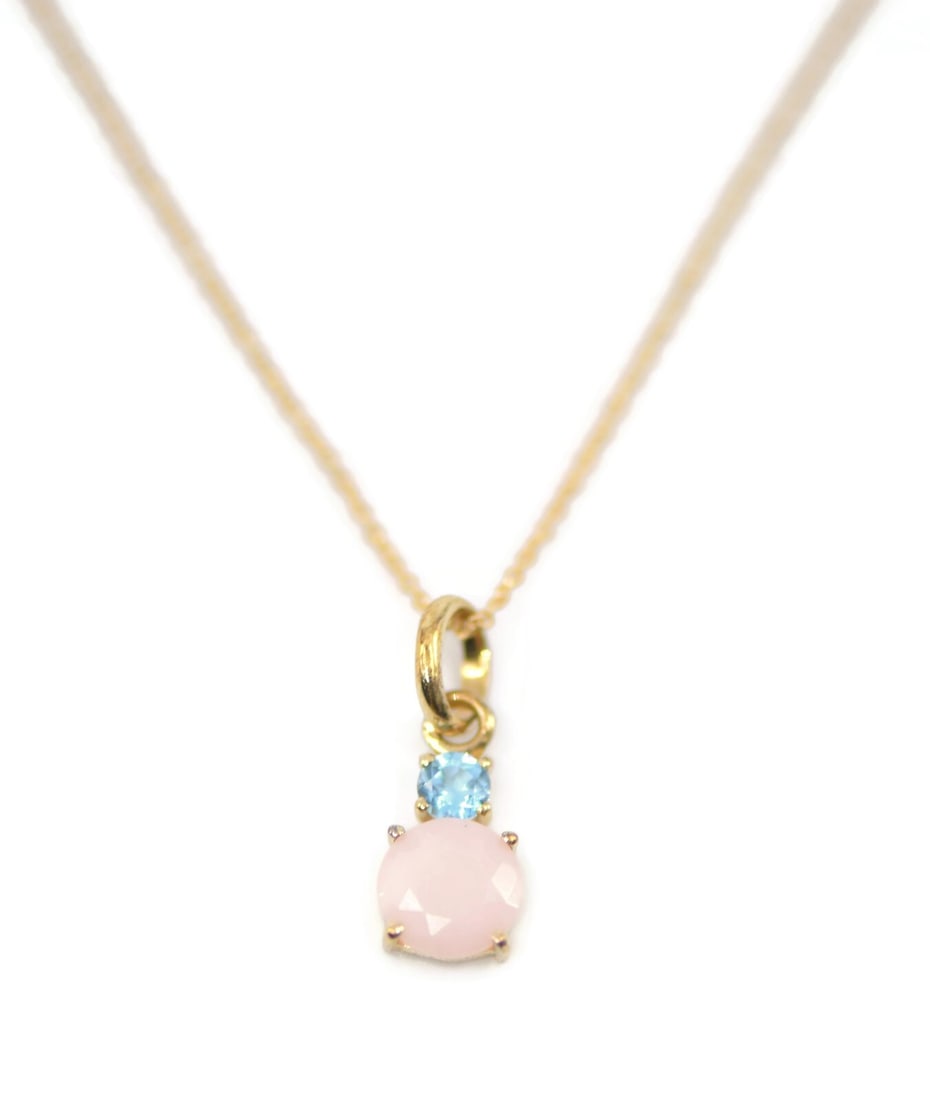 Tous Aquamarine Opal Pendant Necklace in 18K Yellow Gold: Tous Aquamarine Opal Pendant Necklace in 18K Yellow Gold Elevate your jewelry collection with this exquisite Tous Opal Aquamarine Pendant Necklace. Crafted from 18K yellow gold, this necklace features