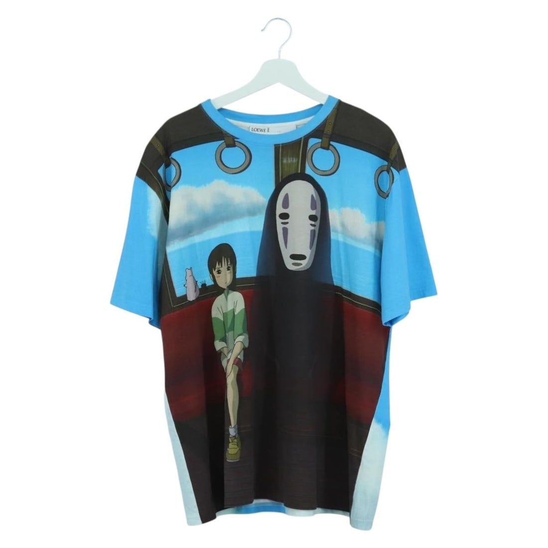 Loewe Spirited Away Blue Cotton T Shirt Featuring Chihiro and No Face: Loewe Spirited Away Blue Cotton T Shirt Featuring Chihiro and No Face This LOEWE x Ghibli Spirited Away T-shirt features Chihiro and No Face graphics on light blue cotton fabric. Designed for women, i
