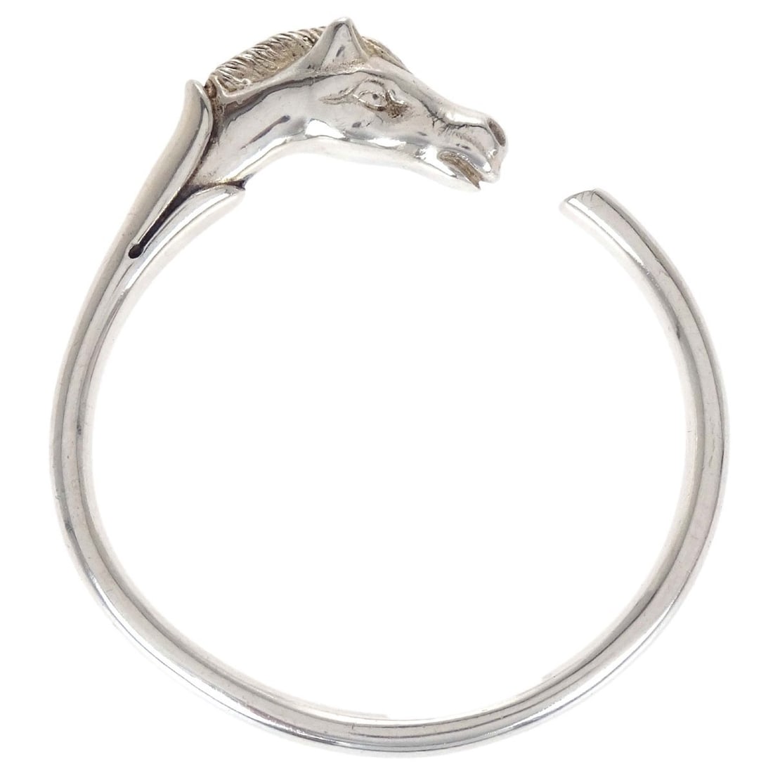 Hermes Cheval silver SV925 bangle bracelet from France: Hermes Cheval silver SV925 bangle bracelet from France Hermes Cheval horse bracelet in a silver-tone SV925 bangle design. Made in France, this bracelet features a clean, minimalist look with no main s