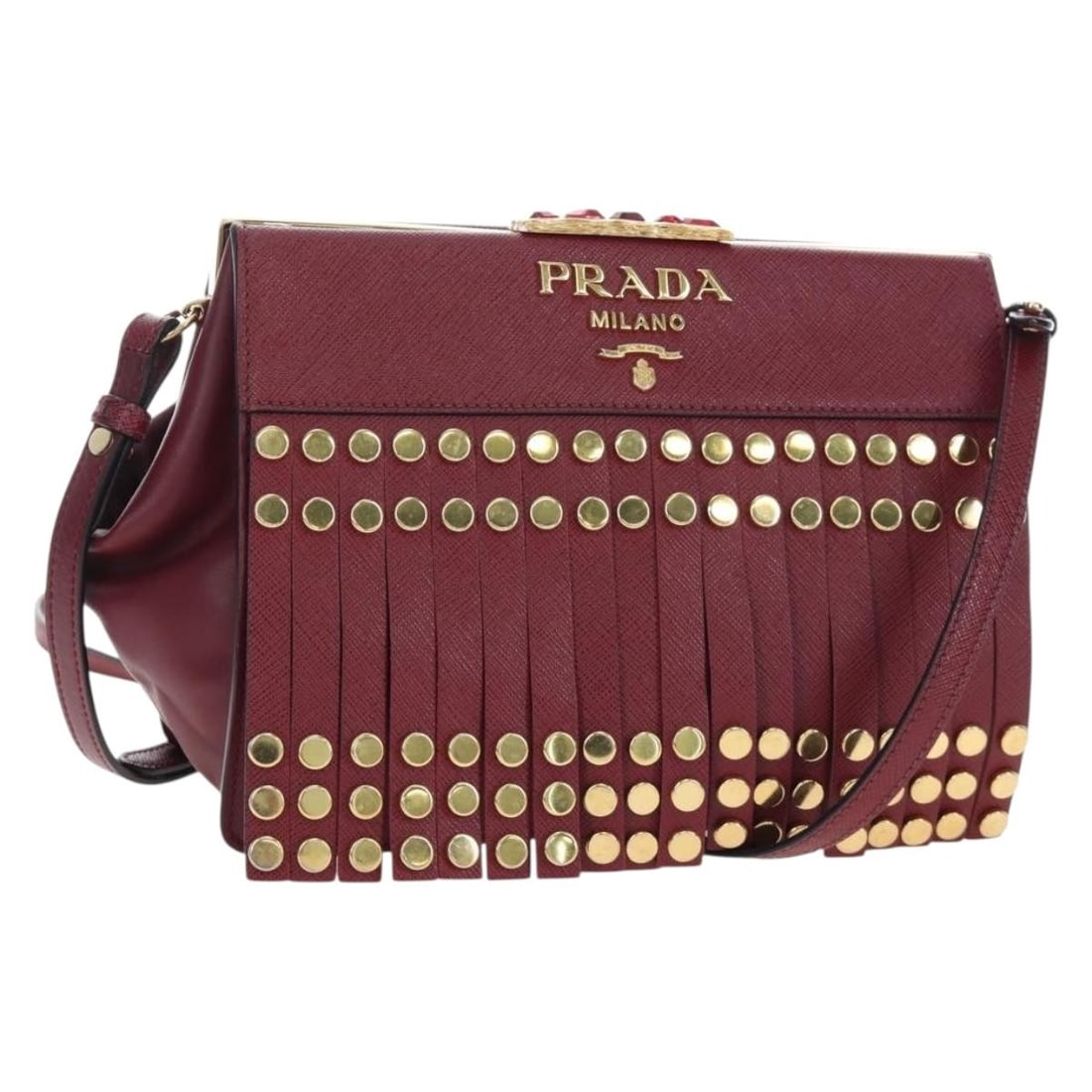 PRADA Saffiano Leather Shoulder Bag Bordeaux Gold Tone Dust Bag: PRADA Saffiano Leather Shoulder Bag Bordeaux Gold Tone Dust Bag A Prada shoulder bag crafted from Saffiano leather in Bordeaux with gold-tone hardware. It comes with a dust bag and was made in Italy. 
