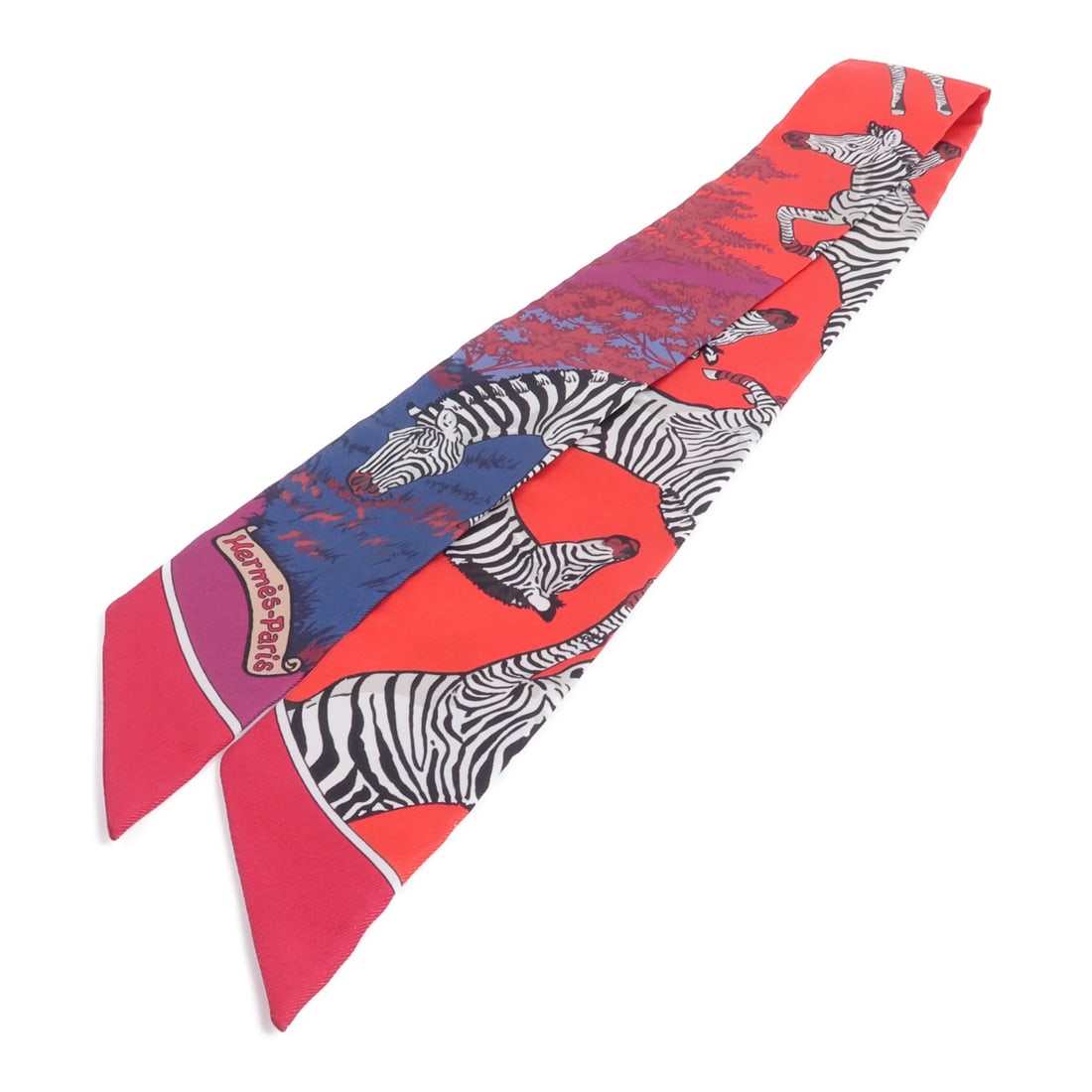 Hermes Twilly silk scarf red multicolor with box: Hermes Twilly silk scarf red multicolor with box Hermes Twilly silk scarf in red and multicolor. Made from silk, it measures 86 cm x 5 cm and comes with a storage box. Condition is AB: Very Good. Spec
