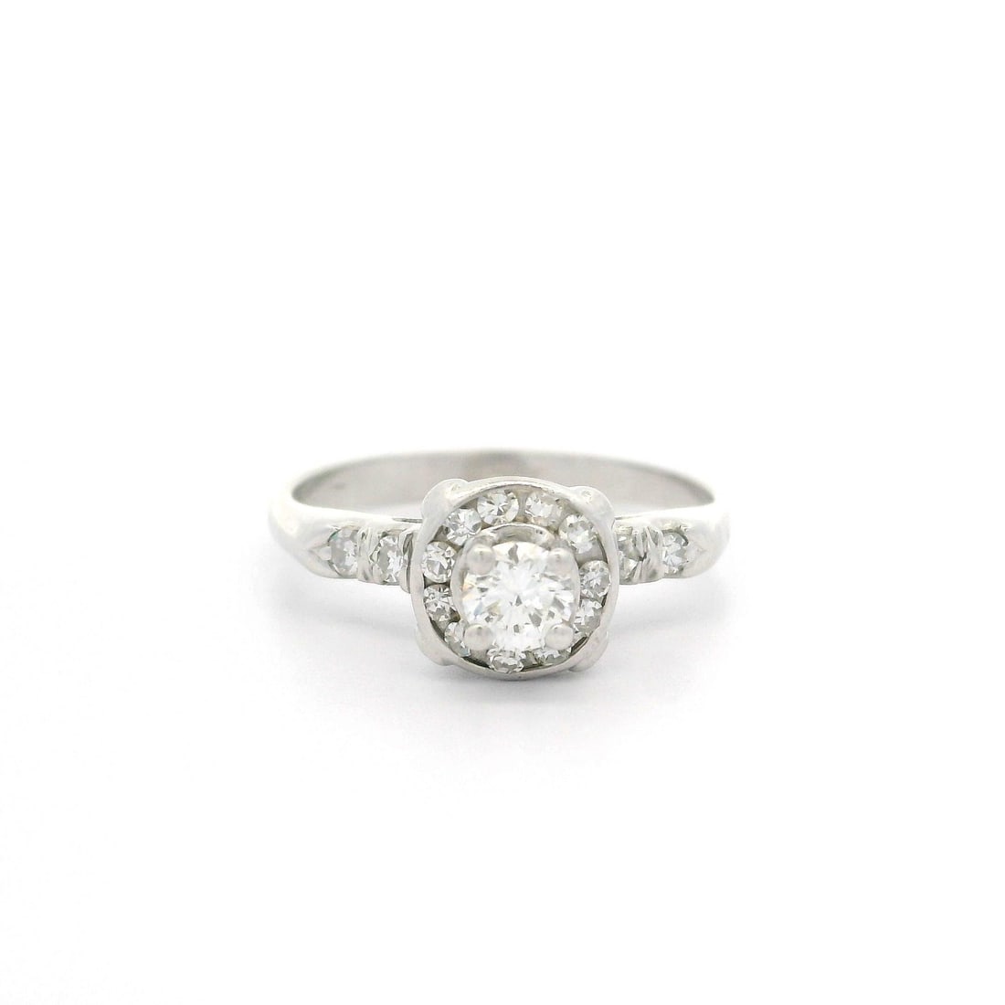 Vintage White Gold .40ct Diamond Solitaire Promise Ring: Vintage White Gold .40ct Diamond Solitaire Promise Ring This vintage promise ring showcases a stunning .40ct fiery illusion set diamond, crafted from solid 13-14k white gold. The ring features a brill