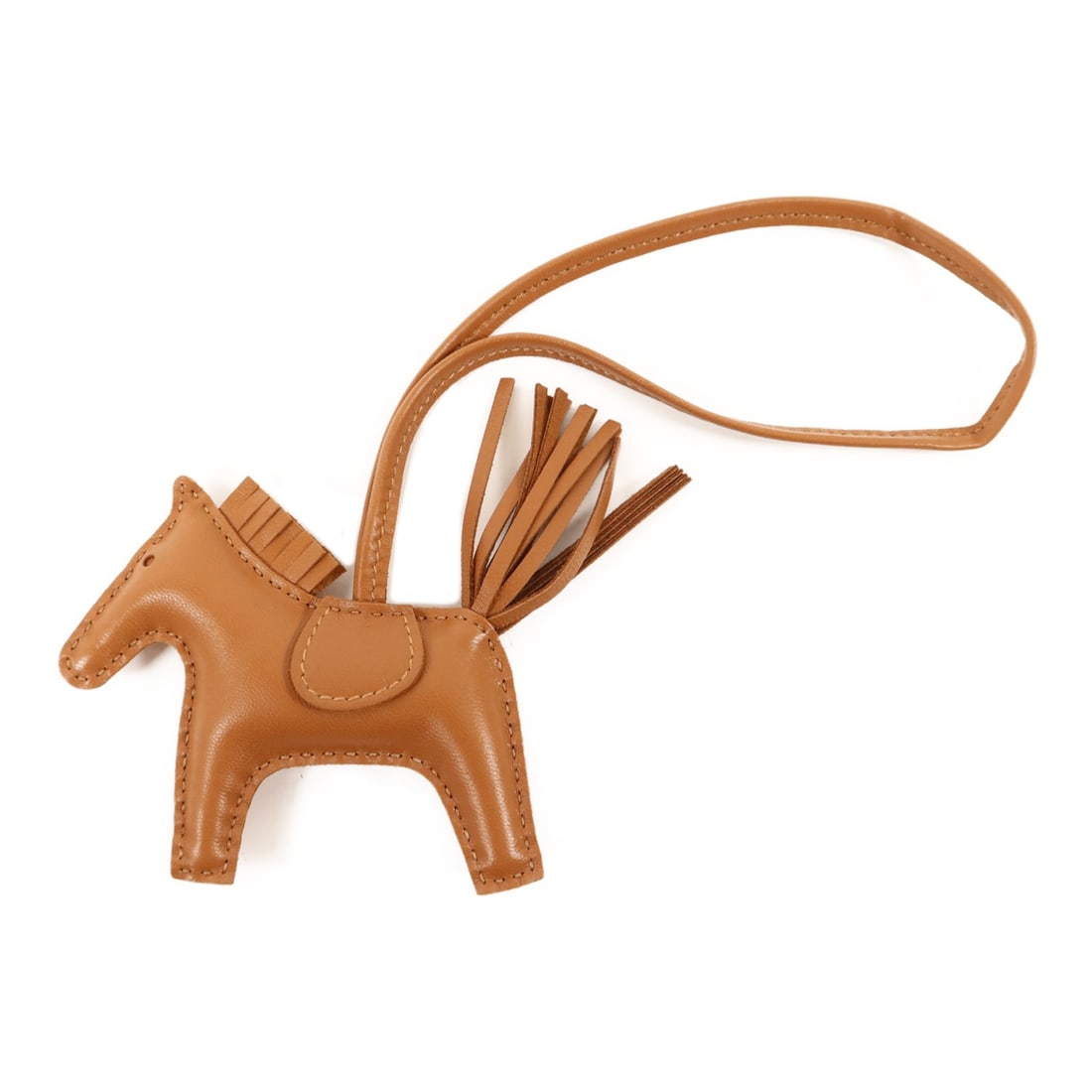 HERMES Rodeo PM Milo Lambskin Charm Gold Brown: HERMES Rodeo PM Milo Lambskin Charm Gold Brown Hermes Rodeo PM charm made from Agneau milo and lambskin (sheep leather) in gold and brown. This women's charm is crafted in France and comes with a stor