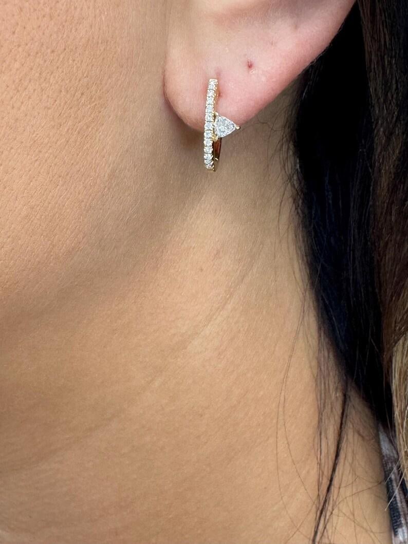 Harbor Diamonds 14K Yellow Gold Hoop Earrings with 0.42ct Diamonds: Harbor Diamonds 14K Yellow Gold Hoop Earrings with 0.42ct Diamonds Elevate your style with these stunning 14 karat yellow gold hoop earrings. Designed in a contemporary style, they feature a striking 