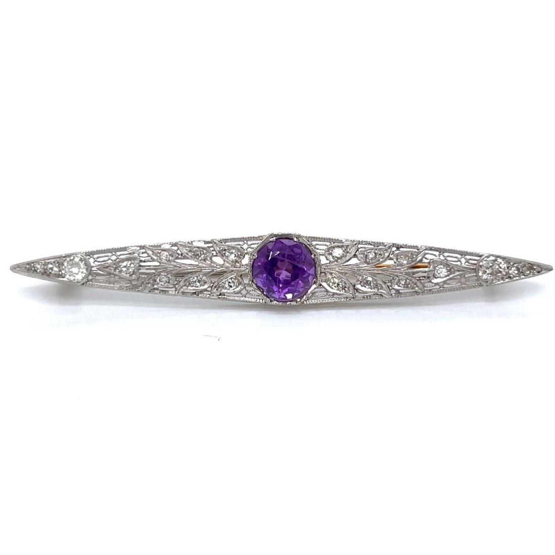 Platinum Gold Brooch with Amethyst and European Cut Diamonds Art Deco: Platinum Gold Brooch with Amethyst and European Cut Diamonds Art Deco This Art Deco brooch is crafted from platinum and gold, featuring approximately 1.25 carats of amethyst and twenty European-cut di