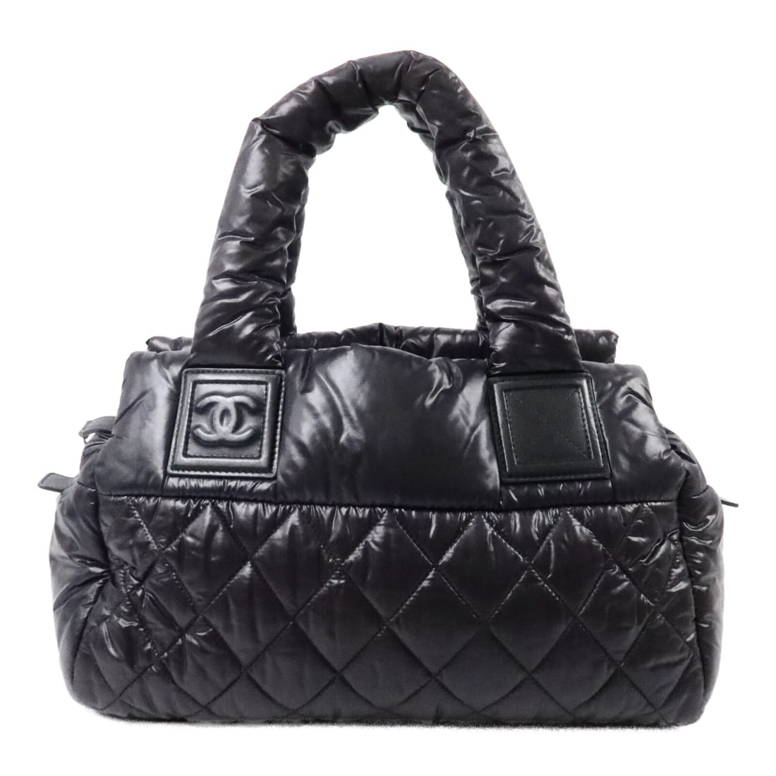 CHANEL CoCo Cocoon Nylon Tote Black with CC and SHW: CHANEL CoCo Cocoon Nylon Tote Black with CC and SHW CHANEL CoCo Cocoon Tote Bag in black nylon with silver-tone hardware. It features a tote silhouette, dual open exterior pockets, one interior zip po