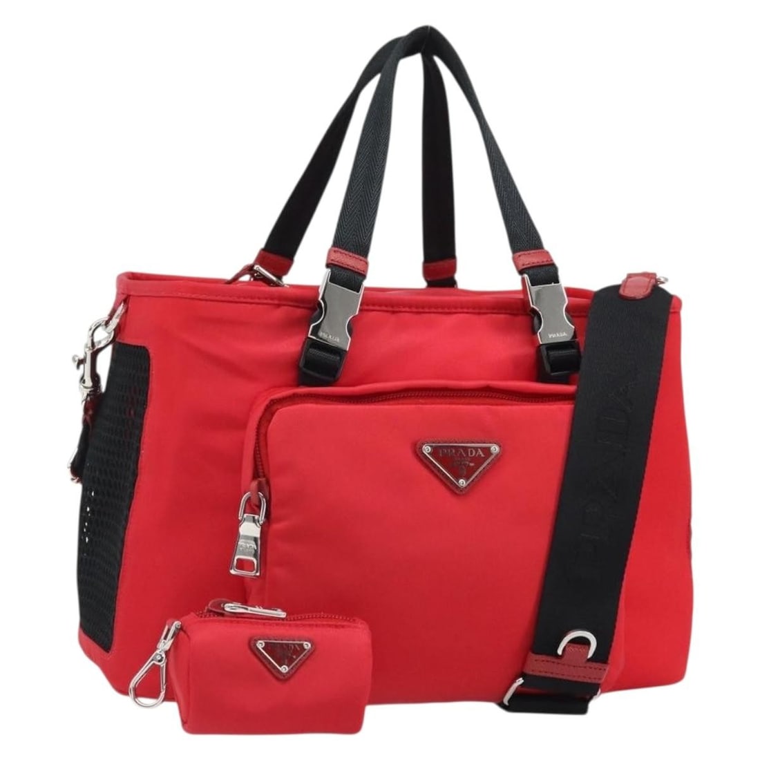 Prada Red Nylon Pet Carrier Bag With Shoulder Strap and Pouch: Prada Red Nylon Pet Carrier Bag With Shoulder Strap and Pouch This Prada pet carry bag is crafted from nylon in a striking red and silver color combination. Designed for versatile use, it features a t
