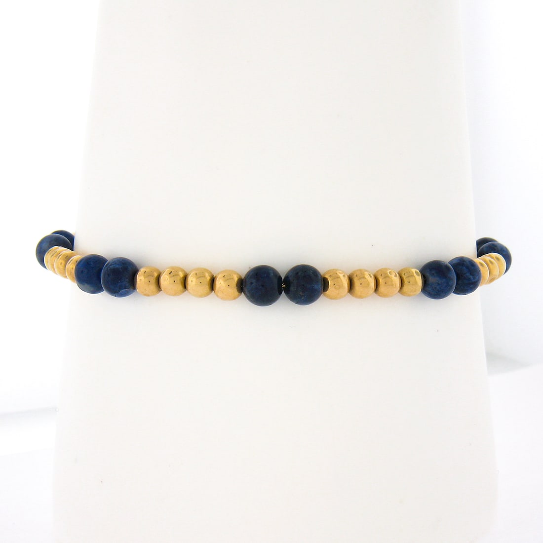 Vintage 14k Yellow Gold Lapis Bead Bracelet 6.75 in: Vintage 14k Yellow Gold Lapis Bead Bracelet 6.75 in Vintage single-strand beaded bracelet crafted in solid 14k yellow gold with natural blue lapis lazuli beads. This original Retro-era piece features 