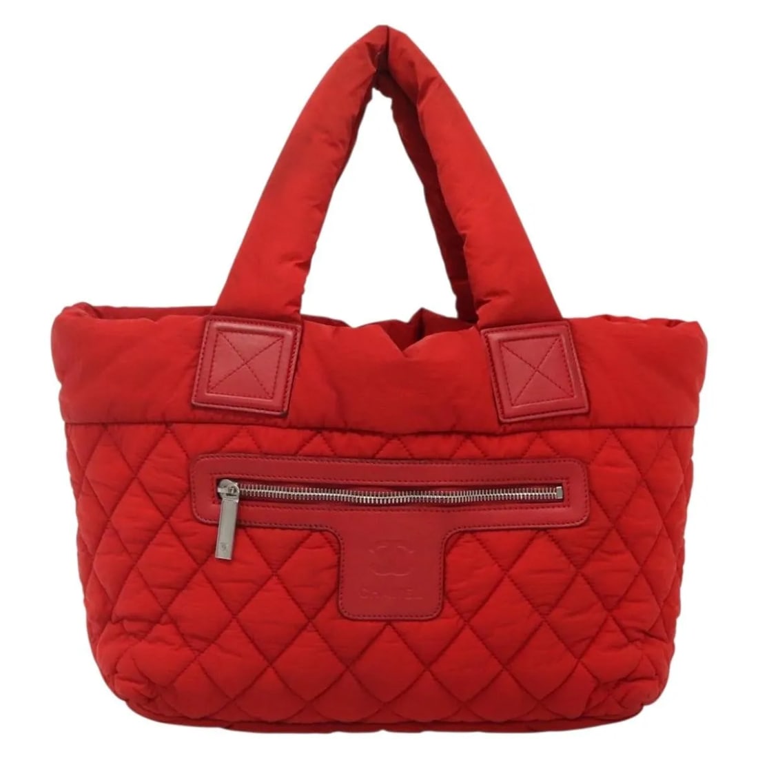 Chanel Coco Cocoon Red Quilted Reversible Nylon Tote Bag: Chanel Coco Cocoon Red Quilted Reversible Nylon Tote Bag The Chanel Coco Cocoon Reversible Tote is crafted from quilted nylon in red and designed for women. This versatile tote features a reversible s