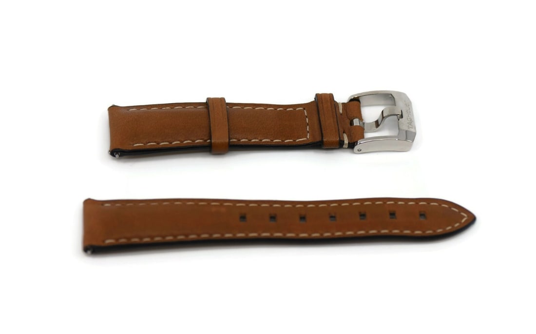 TAG Heuer Authentic Brown Leather Wristwatch Band 17.5mm: TAG Heuer Authentic Brown Leather Wristwatch Band 17.5mm This authentic TAG Heuer wristwatch band is crafted from high-quality brown leather, providing both style and durability. With a band width of 