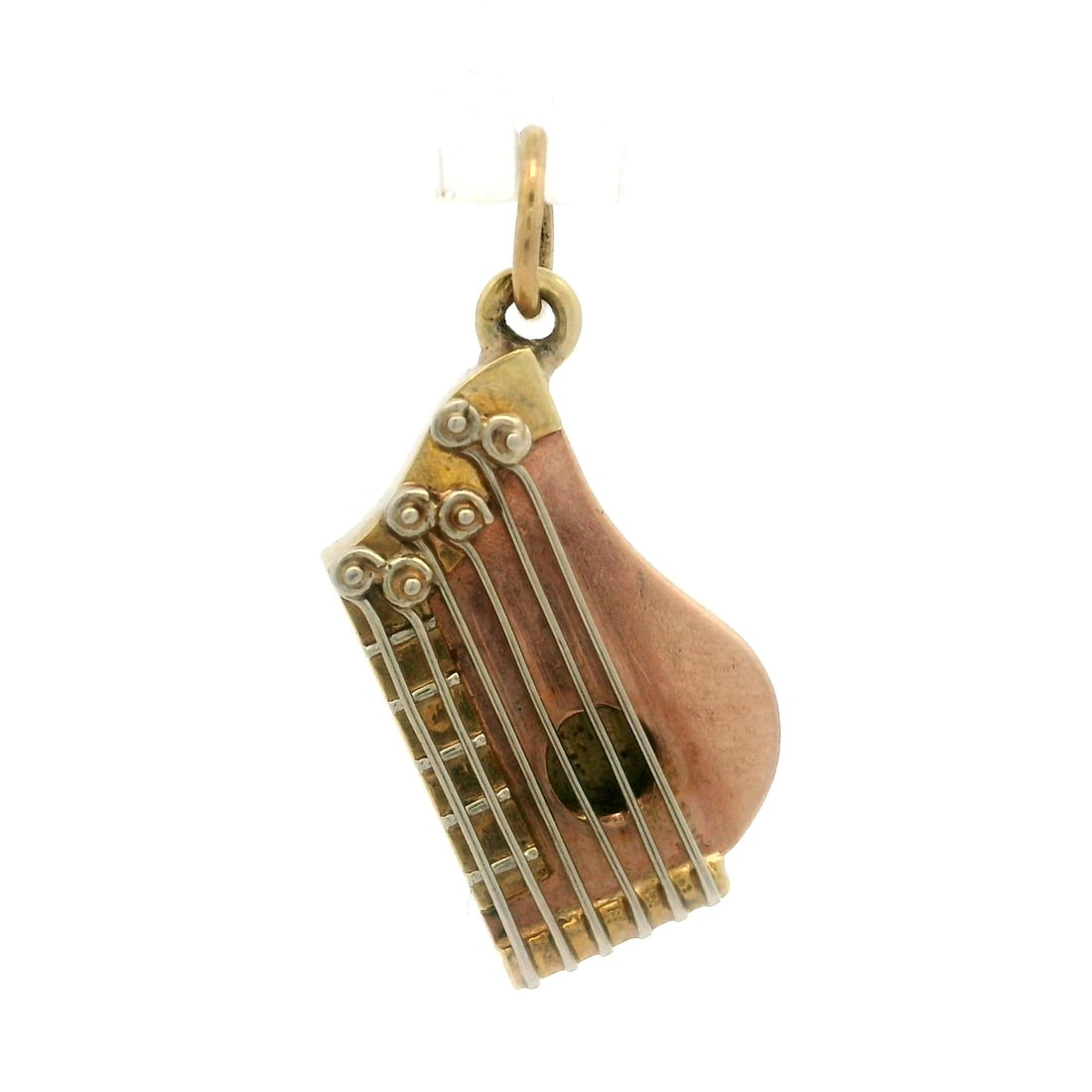 Vintage 14k Yellow Gold Zither Charm Pendant with Bail: Vintage 14k Yellow Gold Zither Charm Pendant with Bail This vintage charm pendant features a delightful zither instrument design, crafted from solid 14k yellow gold. Weighing 1.77 grams, this piece is