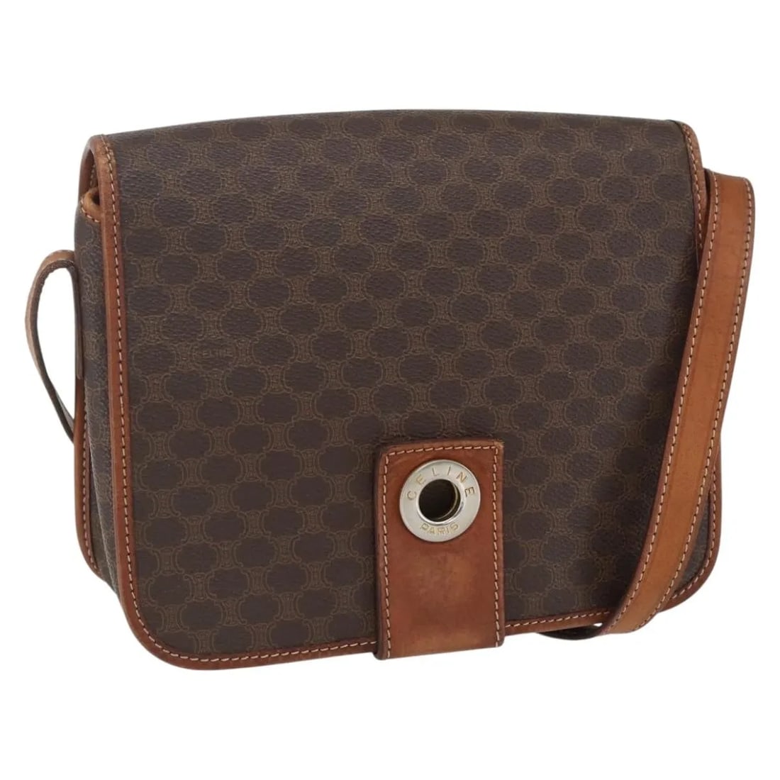 Brown PVC Celine Macadam Shoulder Bag 22cm by 18cm by 7cm: Brown PVC Celine Macadam Shoulder Bag 22cm by 18cm by 7cm This Celine Macadam shoulder bag is crafted from brown PVC material with a canvas circle design. It features a shoulder strap and metal fittin