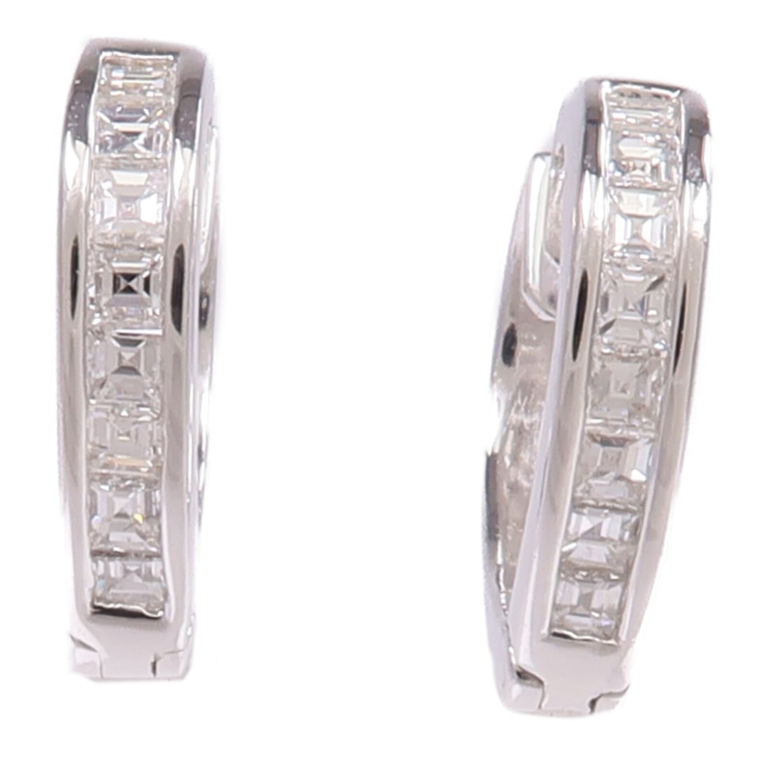 18K White Gold Diamond Pierced Earrings: 18K White Gold Diamond Pierced Earrings Diamond earrings in 18K white gold with diamond accents. The earrings are described as clear in color and measure 8 mm x 2.5 mm. Weight is 3.2 g. Condition is A