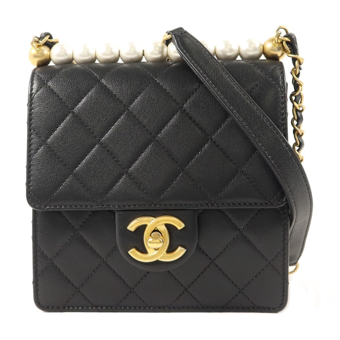 CHANEL AS0584 Small Pearl Flap Shoulder Bag Black Calfskin CC GHW: CHANEL AS0584 Small Pearl Flap Shoulder Bag Black Calfskin CC GHW A CHANEL small pearl flap shoulder bag in black calfskin leather. It features a turn lock closure, an interior with two open compartme