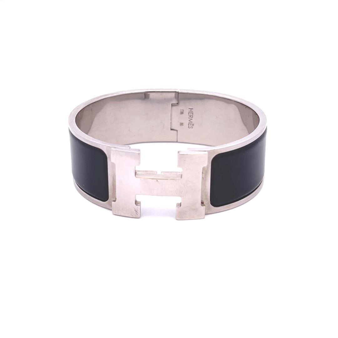 Hermes Clic Clack Silver Plated Enamel H Bangle 20mm Wide: Hermes Clic Clack Silver Plated Enamel H Bangle 20mm Wide Elevate your style with this chic and fashionable Hermes bracelet from the Clic Clack Collection. Crafted from silver-plated metal, this stunn