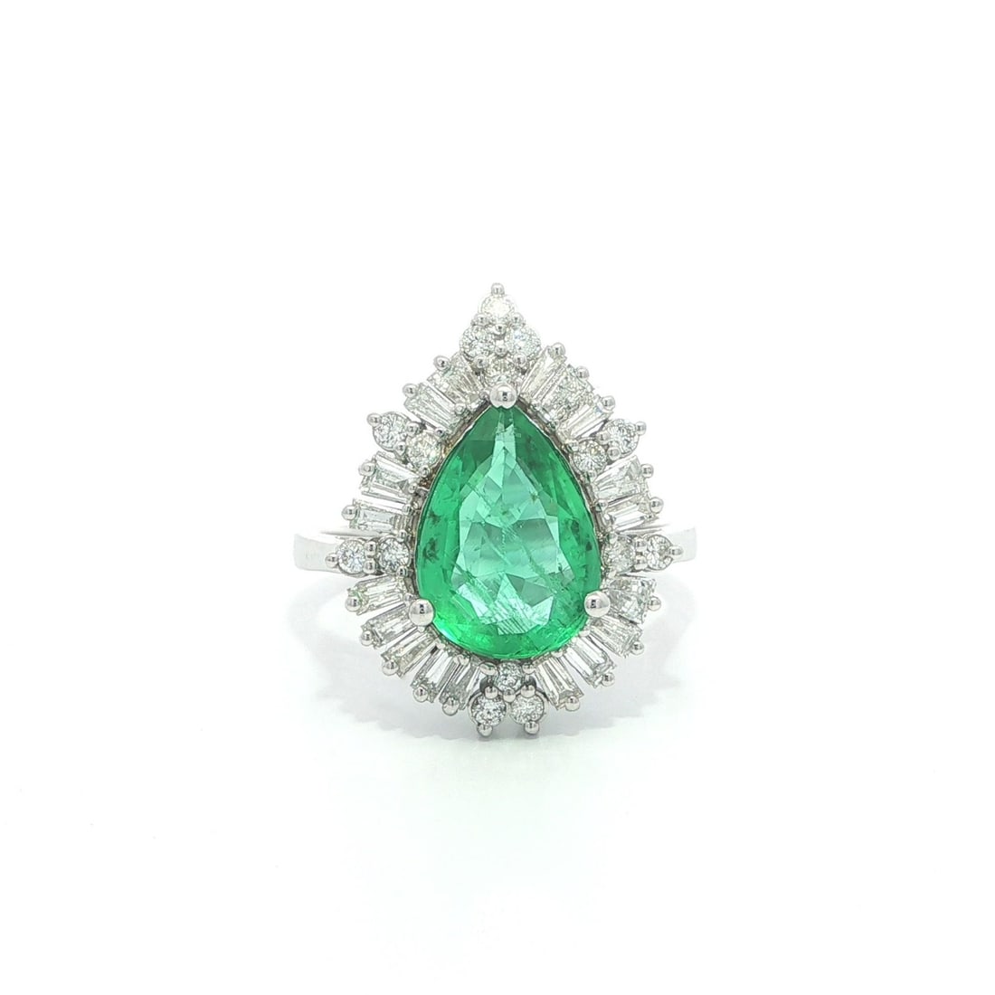 GIA Certified 3.01ct Pear Emerald and Diamond Cocktail Ring in 18k White Gold: GIA Certified 3.01ct Pear Emerald and Diamond Cocktail Ring in 18k White Gold This elegant cocktail ring features a natural pear-cut emerald weighing 2.26 carats, certified by GIA with minor oil clari