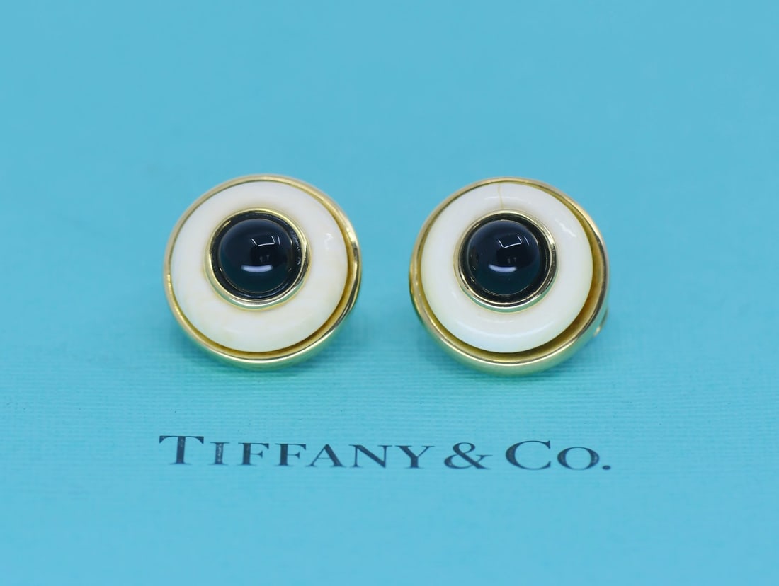 Tiffany & Co Huggie Earrings 18K Yellow Gold Mother of Pearl Abalone: Tiffany & Co Huggie Earrings 18K Yellow Gold Mother of Pearl Abalone These elegant huggie earrings are crafted from 18k yellow gold and feature exquisite mother of pearl and abalone stones. Made in It