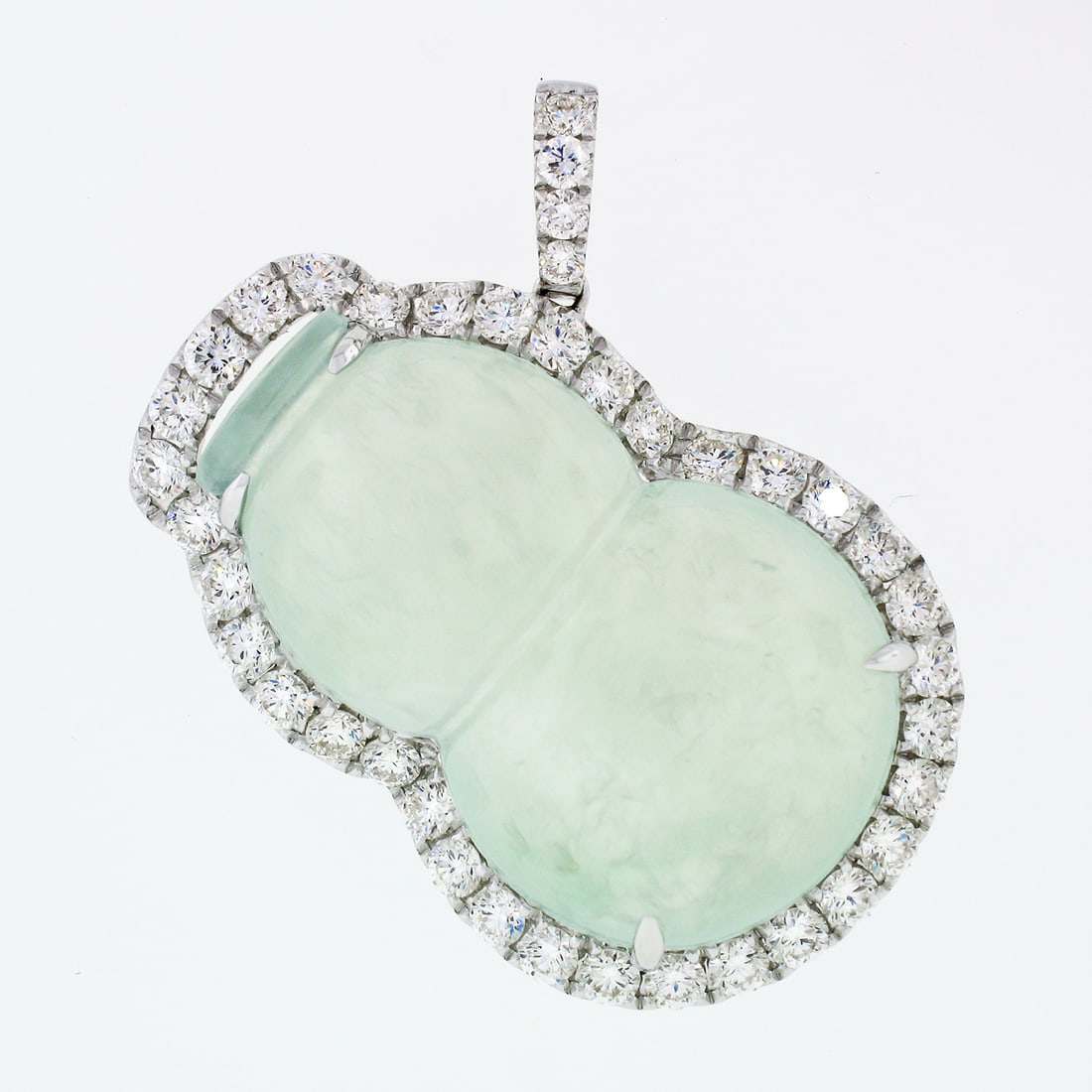 S H 18k White Gold AGL Jadeite & 2.10ctw Diamond Pendant: S H 18k White Gold AGL Jadeite & 2.10ctw Diamond Pendant This exquisite pendant showcases a stunning free-form carved jadeite jade, featuring a pale grayish green hue, set in solid 18k white gold. The