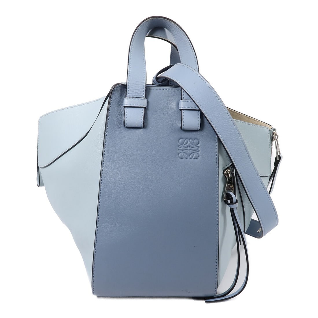 Blue Calfskin 2 Way Shoulder Bag LOEWE Hammock Medium SHW: Blue Calfskin 2 Way Shoulder Bag LOEWE Hammock Medium SHW This LOEWE Hammock Medium 2 Way Shoulder Bag is crafted from calfskin (cowhide) leather in blue. It is designed for women and features a 2-way