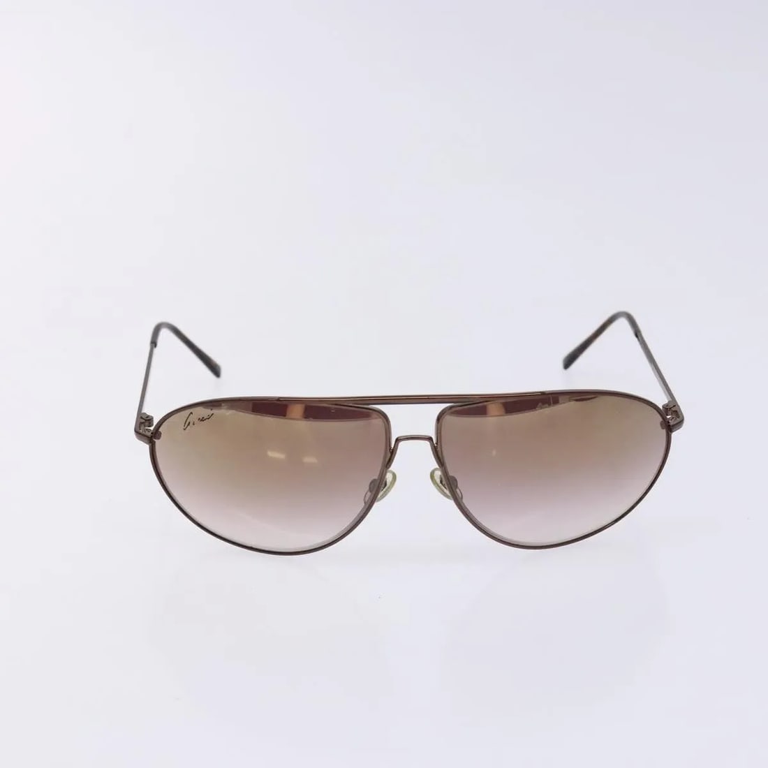 Brown Metal Gucci Eyewear Women's Sunglasses Italy: Brown Metal Gucci Eyewear Women's Sunglasses Italy These Gucci sunglasses are designed for women and feature a brown metal frame. Made in Italy, they offer a stylish look with a comfortable fit. The s