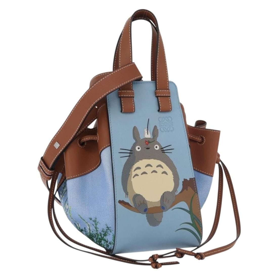 LOEWE Hammock Tote My Neighbor Totoro Studio Ghibli Canvas Light Blue: LOEWE Hammock Tote My Neighbor Totoro Studio Ghibli Canvas Light Blue A LOEWE x Studio Ghibli My Neighbor Totoro hammock bag in light blue canvas, presented as a women's handbag made in Spain. It come