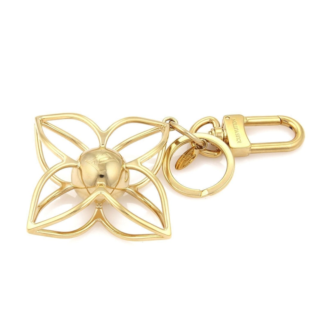Louis Vuitton Monogram Floral Key Chain Gold Tone Plated Metal: Louis Vuitton Monogram Floral Key Chain Gold Tone Plated Metal Vintage Louis Vuitton large monogram floral key ring in gold-tone plated metal, made in France. It features an oversized floral and monog