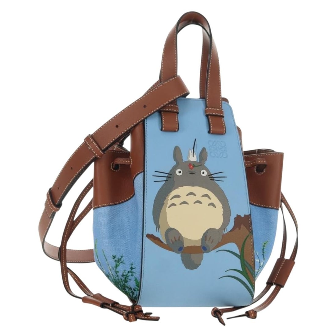 LOEWE Hammock Small Blue Leather Hand Bag Totoro Dust Bag Strap: LOEWE Hammock Small Blue Leather Hand Bag Totoro Dust Bag Strap This LOEWE Ghibli Collaboration Totoro Hammock Small Bag is a blue leather handbag made in Spain. It comes with a dust bag and shoulder 