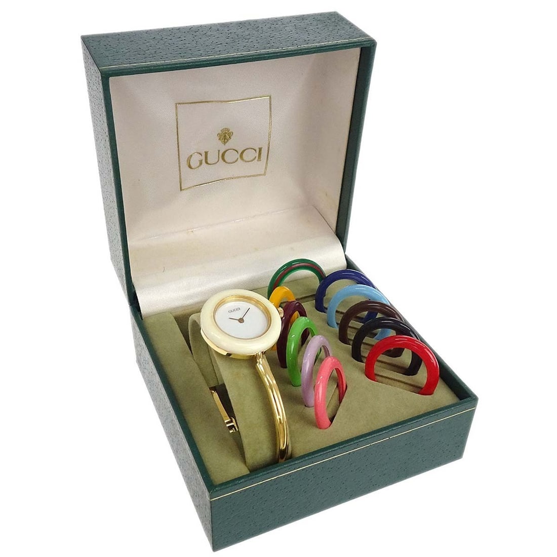 Gucci 11 12.2 Change Bezel Chameleon Women's Quartz Wristwatch: Gucci 11 12.2 Change Bezel Chameleon Women's Quartz Wristwatch Gucci 11/12.2 Change Bezel Chameleon quartz wristwatch with a round stainless steel case, white analog dial, and gold-tone stainless stee