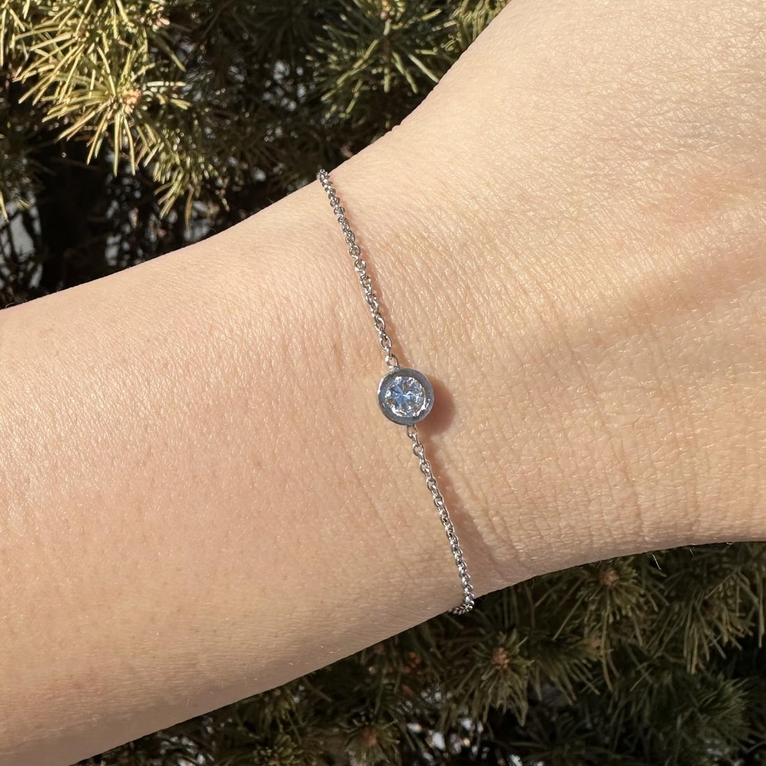Platinum Bracelet with 0.28ct Round Bezel Set Diamond Station: Platinum Bracelet with 0.28ct Round Bezel Set Diamond Station This platinum stackable bracelet features a 0.28 carat natural round brilliant cut diamond set in a bezel solitaire station. The diamond i