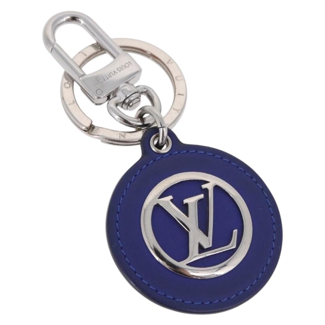 Louis Vuitton M00744 blue silver metal key holder charm: Louis Vuitton M00744 blue silver metal key holder charm Louis Vuitton Porte Cles LV Padded Circle key holder in blue and silver metal, made in Italy. The item measures approximately 5 cm x 5 cm, with 