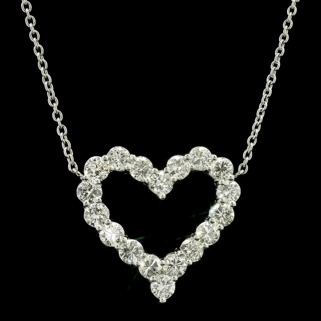 3ctw White Gold Heart Pendant Necklace with Diamonds: 3ctw White Gold Heart Pendant Necklace with Diamonds This exquisite heart pendant necklace features a stunning arrangement of (18) round brilliant cut diamonds, totaling approximately 3.0 carats. The 
