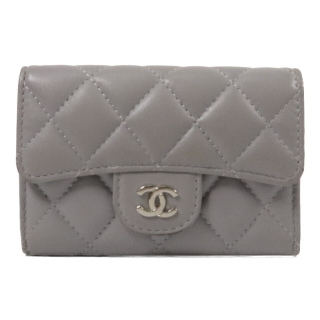 CHANEL AP0214 Classic Flap Lambskin Card Holder Gray: CHANEL AP0214 Classic Flap Lambskin Card Holder Gray A CHANEL Classic Flap card holder in grey lambskin leather with silver-tone hardware. It features a hook button closure and two card slots. The ite