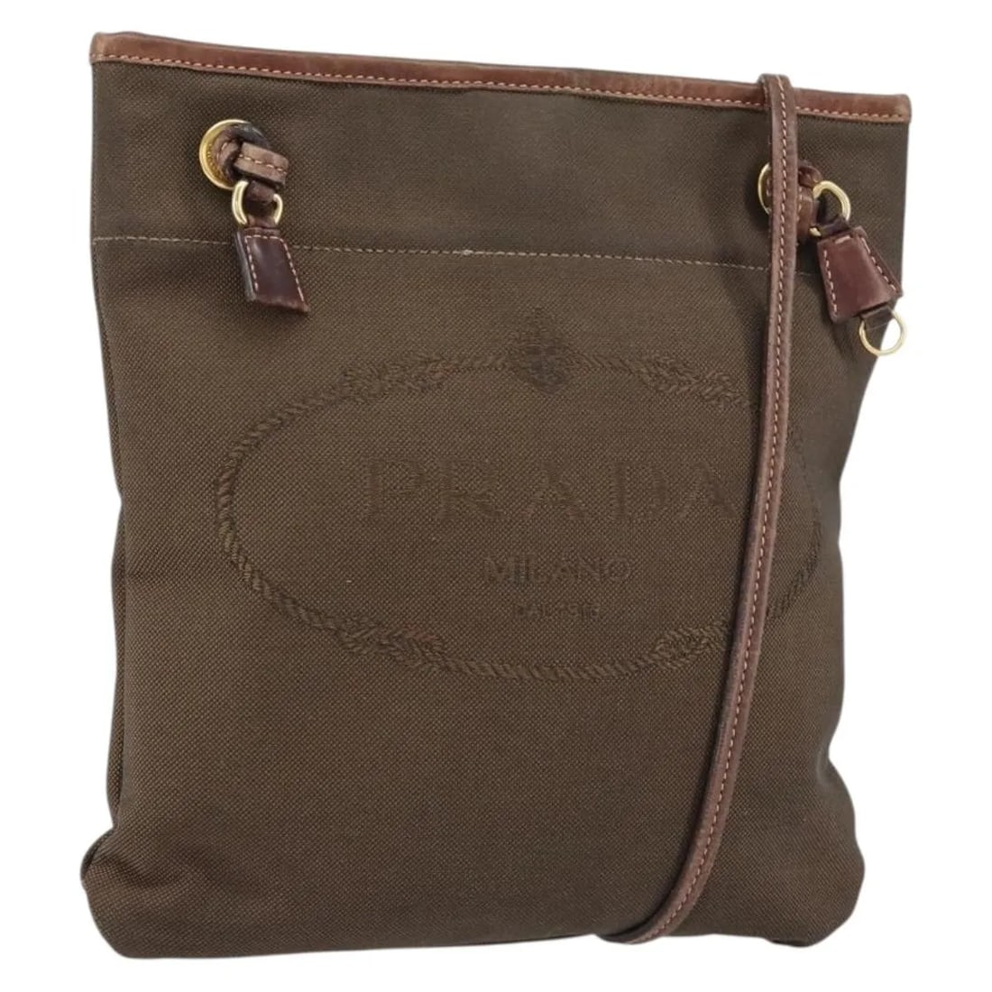 Prada Canvas Messenger Bag Logo Flat Brown 24x26x1 cm: Prada Canvas Messenger Bag Logo Flat Brown 24x26x1 cm This Prada Logo Flat Messenger bag for women features a brown canvas construction with a flat silhouette. Made in Italy, it has a compact size sui
